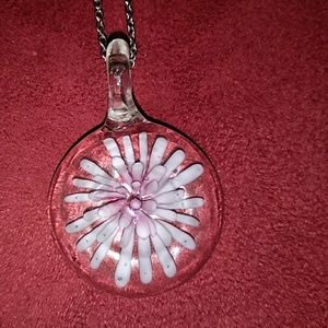 It's  another hand blown glass piece with a flower